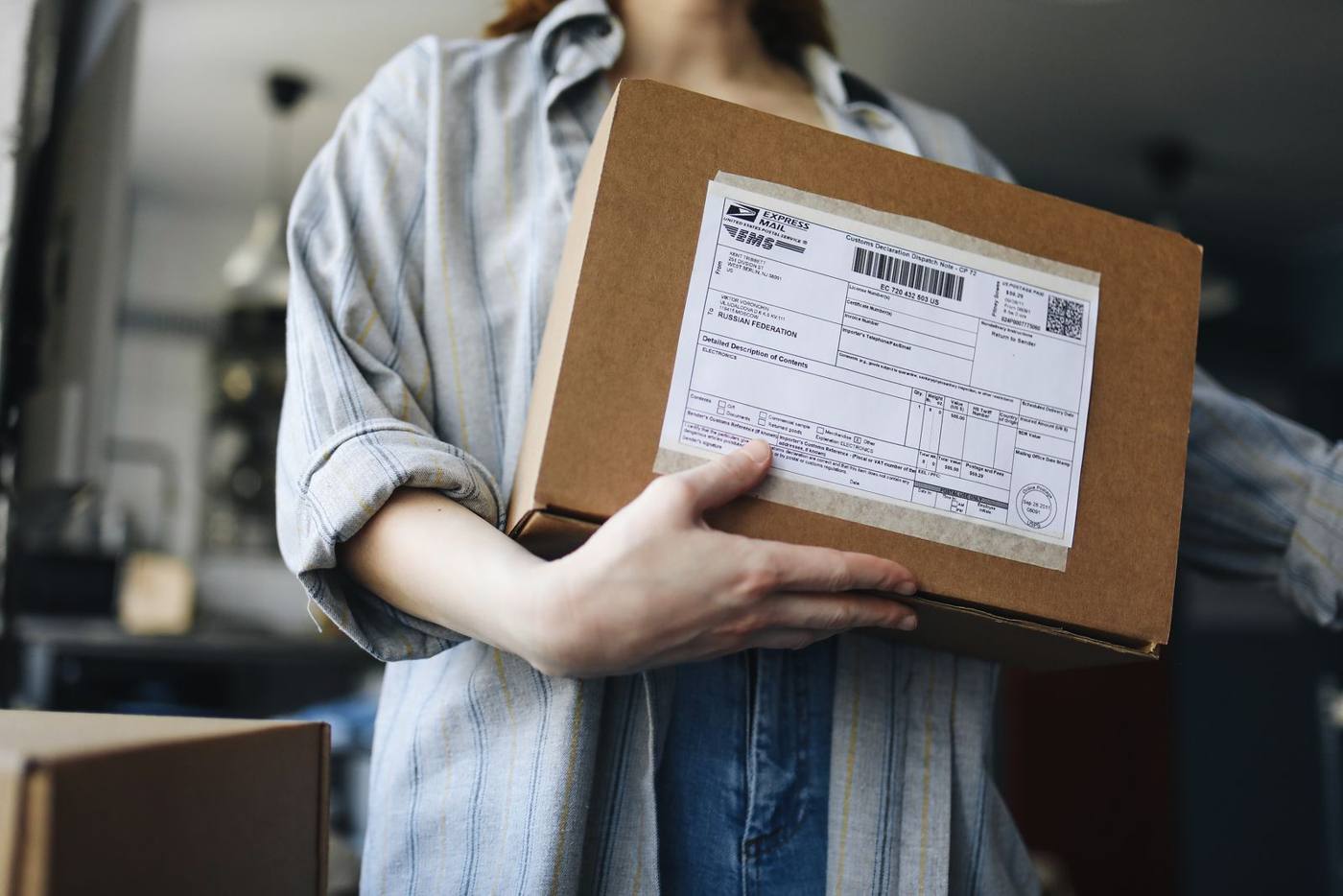 Shipping boxes and labels ready in an ecommerce warehouse.