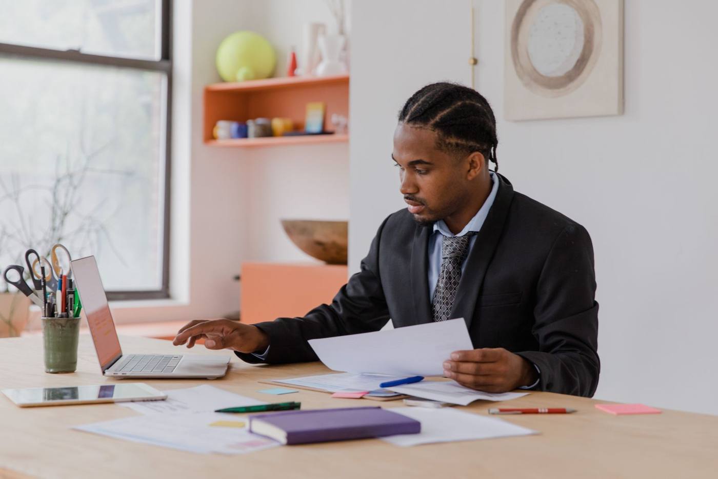 An entrepreneur reading a document about AI regulation at their desk