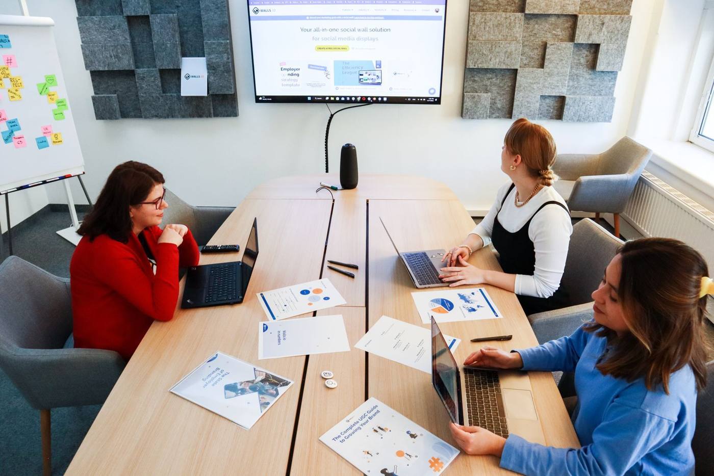 Team comparing AI provider options on a screen, in an office
